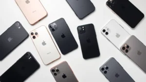 Professional flat lay of multiple refurbished iPhones in excellent condition arranged on a clean white desk with subtle shadows, showing various color options and minimal wear, business photography style